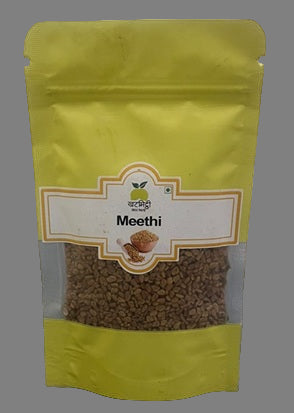Yellow packaging of 'Meethi' with a clear window on a gray background